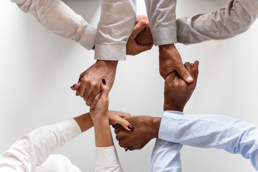 black-group-hands-943630-865x577